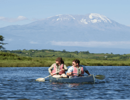 Canoeists beneath Mount Kilimanjaro