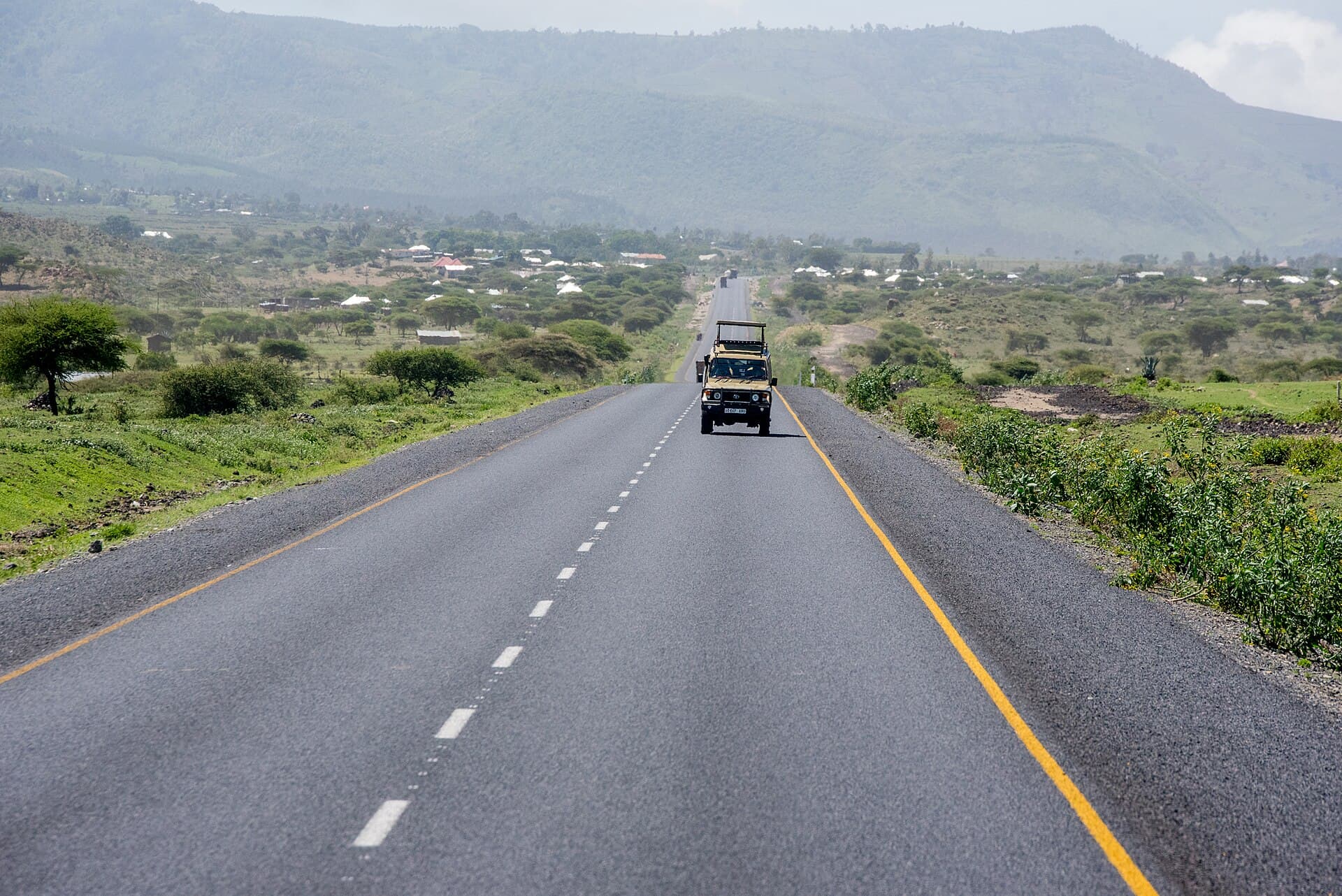 Safari vehicle travelling through northern Tanzania